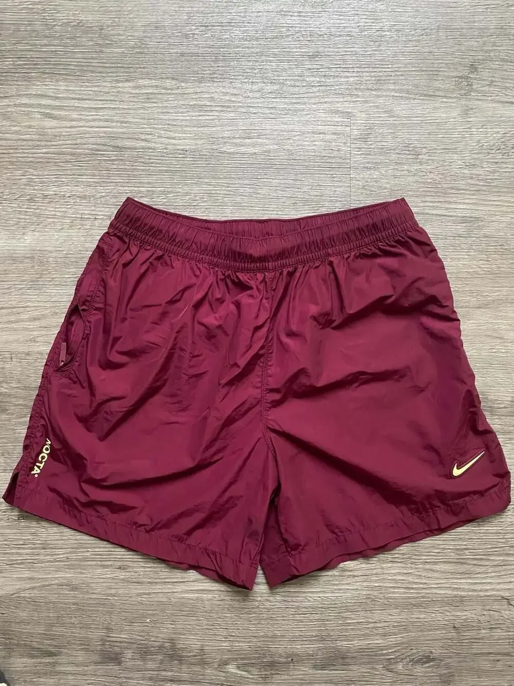 Nike x NOCTA Cardinal Nylon Shorts in Dark Beetroot